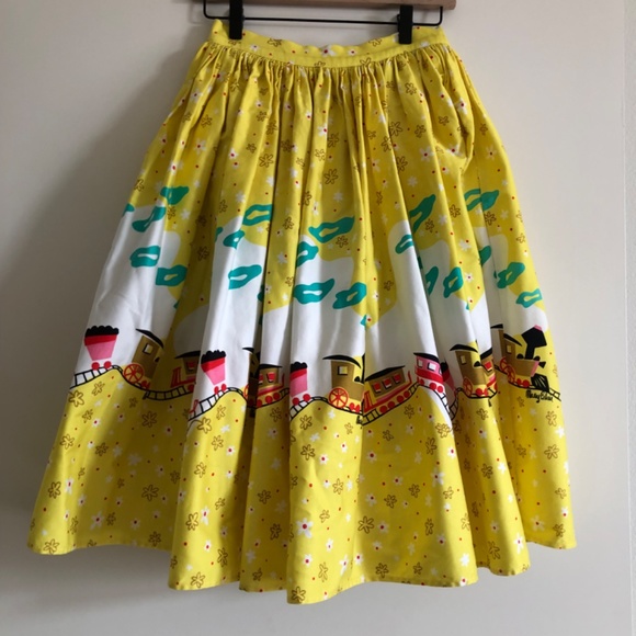 Pinup Couture Jenny Skirt in Mary Blair "Bon Voyage" Yellow Train Print, Small - Picture 2 of 10